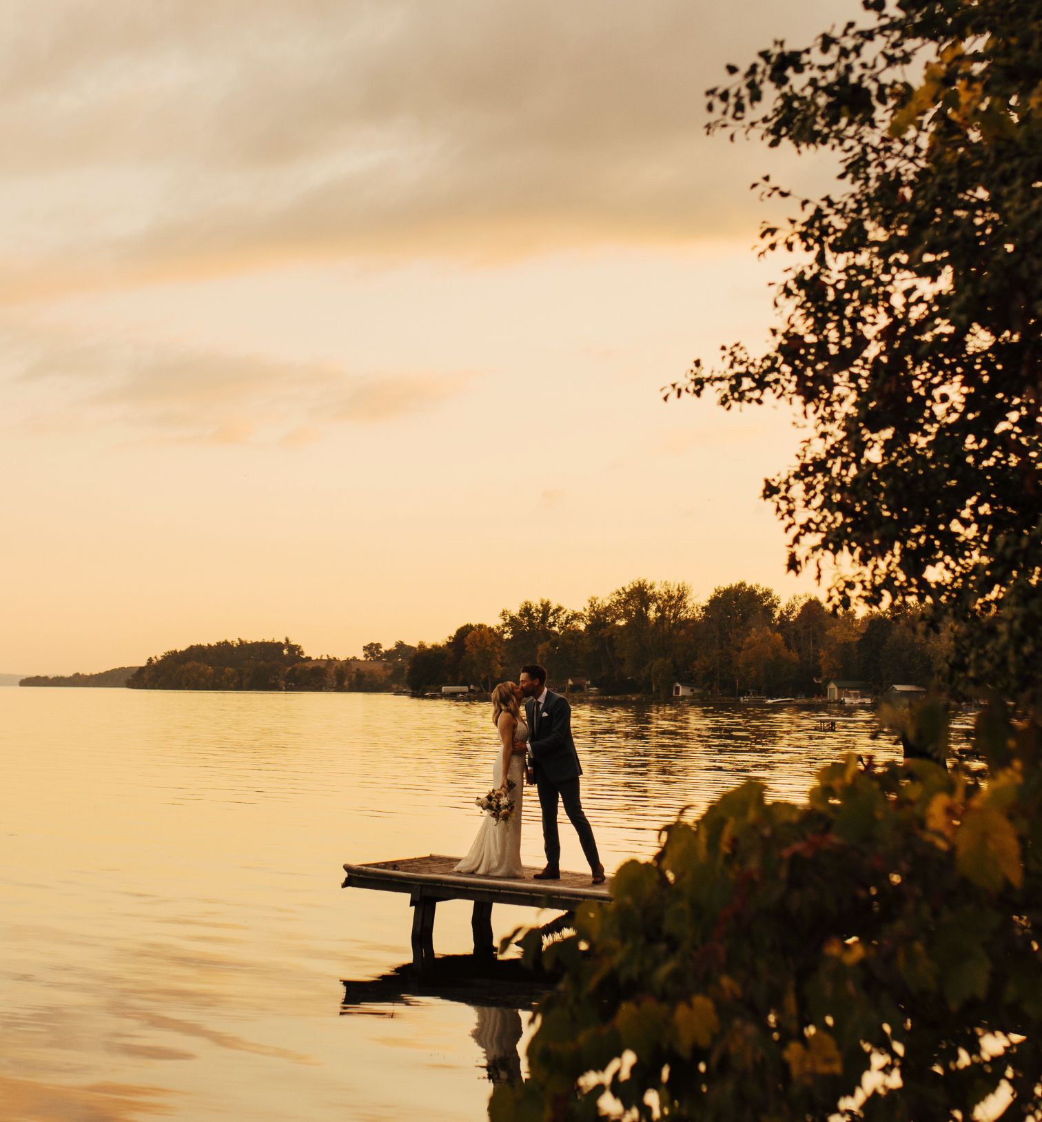 wedding couple at edge of lake